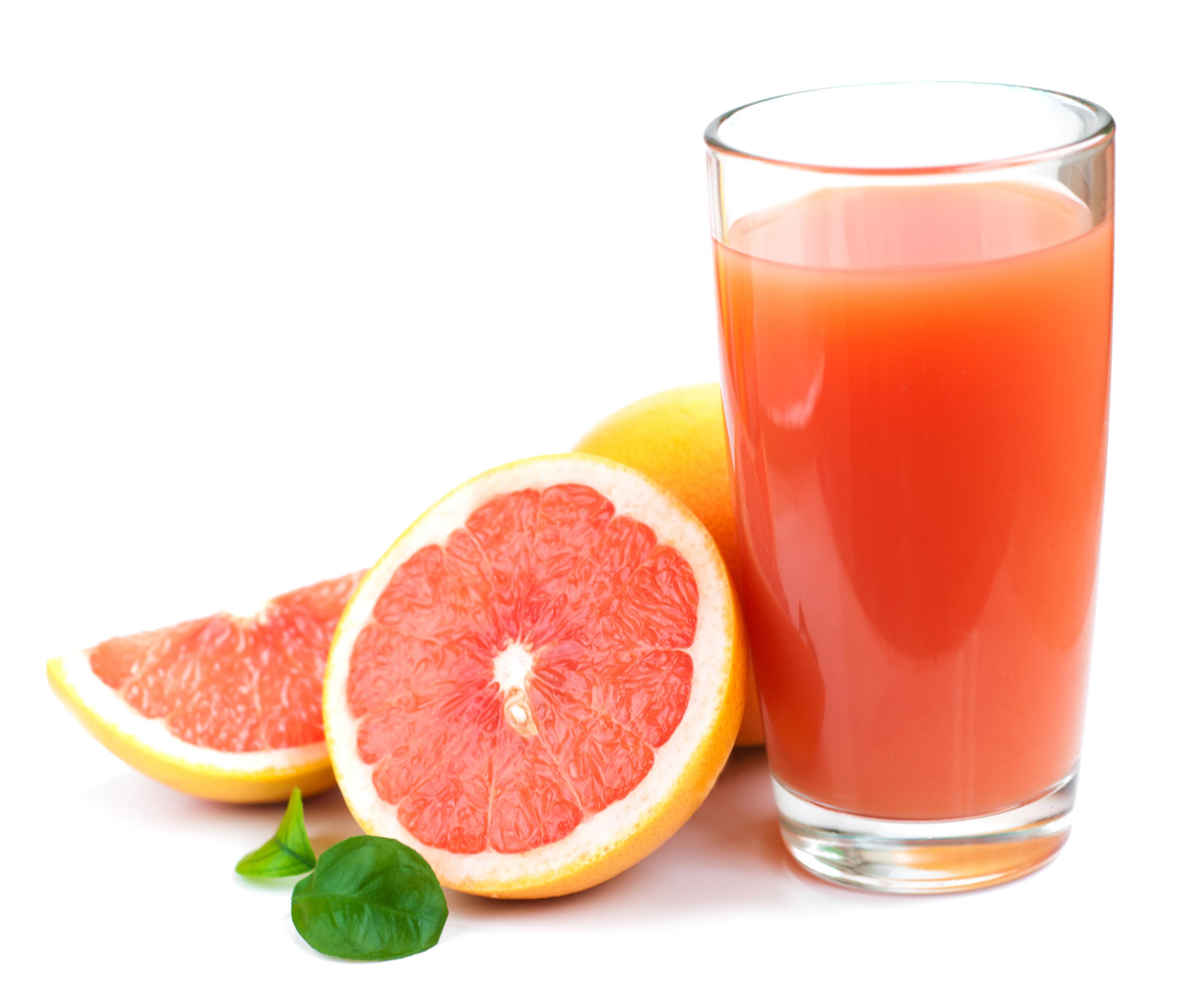 Grapefruit juice and ripe grapefruits on a white background